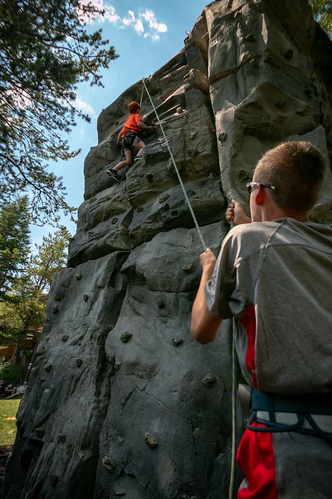 Two children using the climbing wall at Jackson Hole Mountain Resort