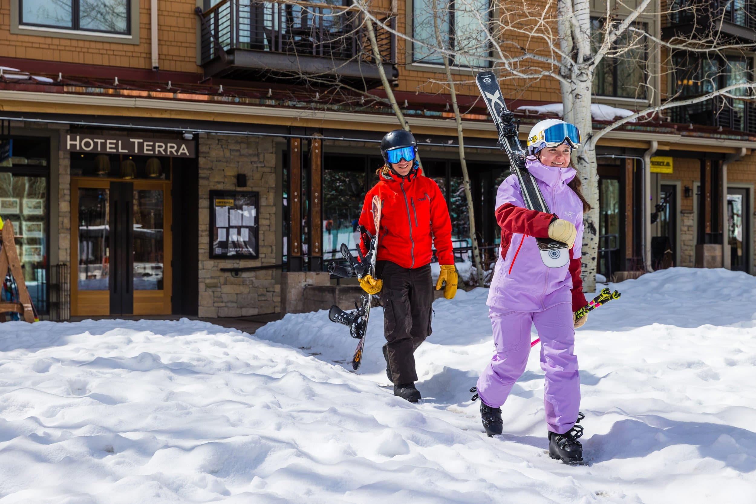Skiers Walking Out Of Hotel Terra