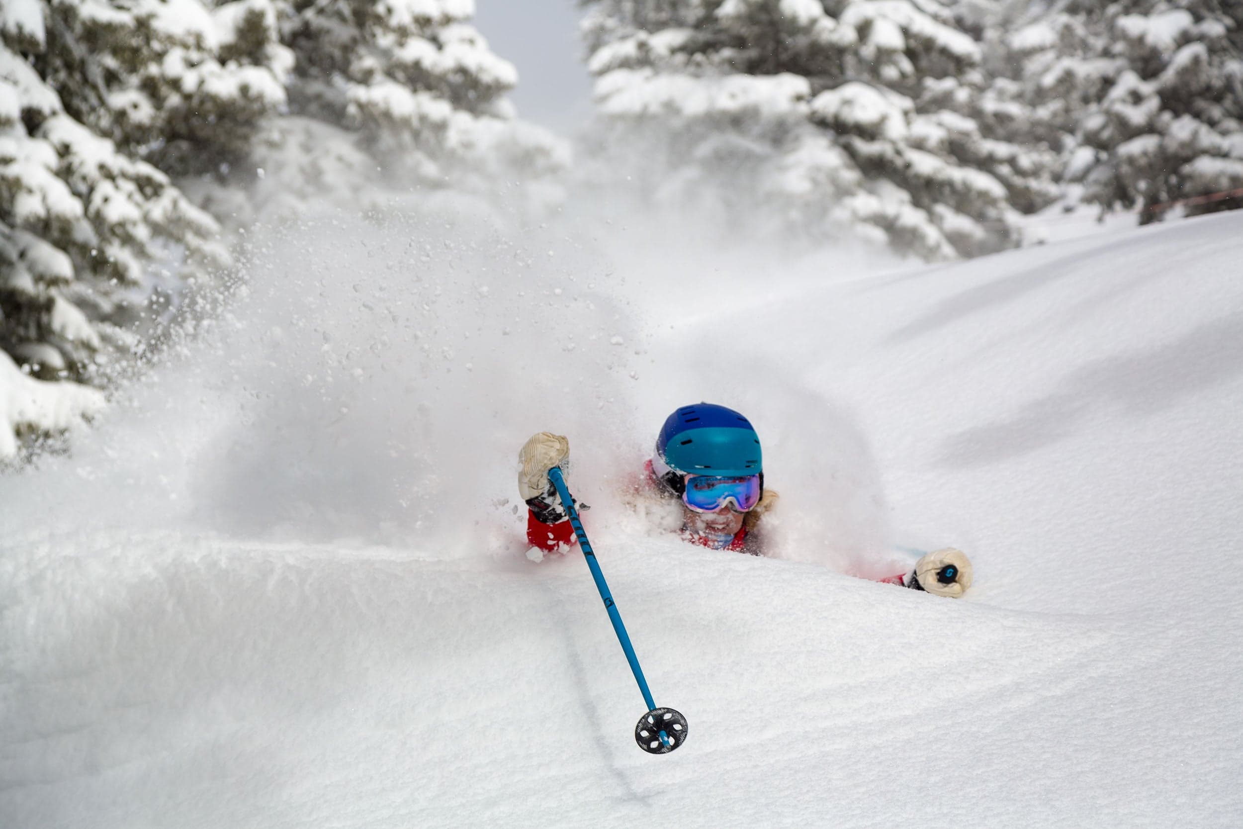 A skiier in deep powder snow at Jackson Hole Mountain Resort, Wyoming.