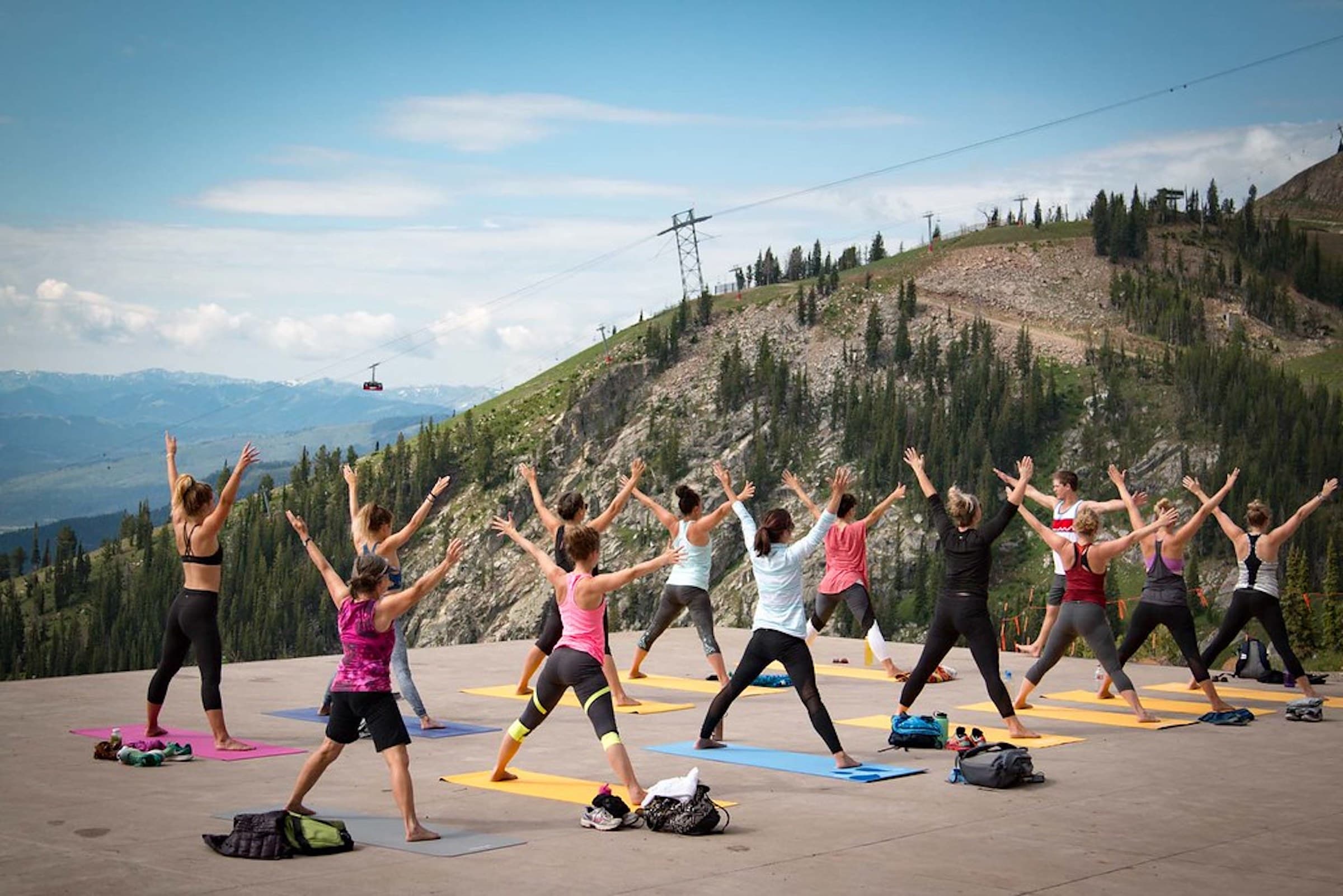 A group doing yoga in the mountains at Hotel Terra, Jackson Hole