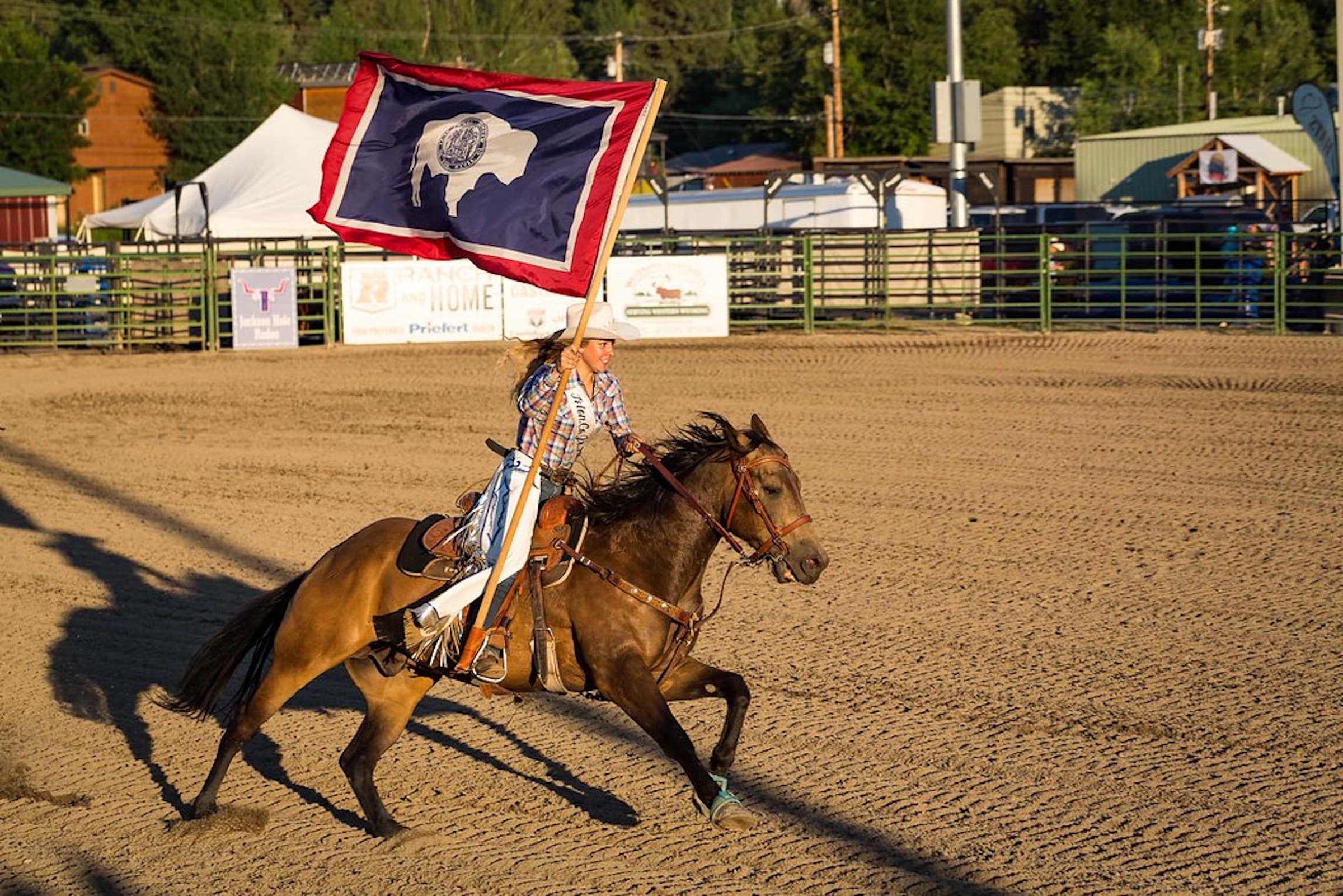 A cowgirl on horseback at a rodeo in Jackson Hole