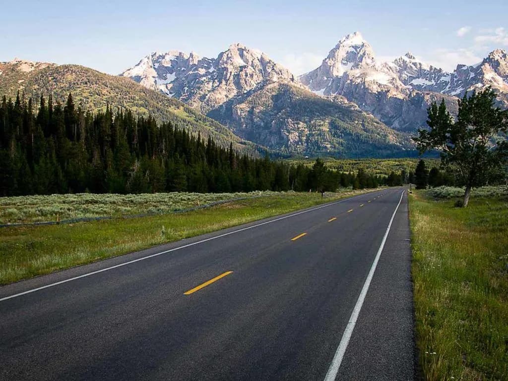 An open road in the mountains in Jackson Hole Wyoming