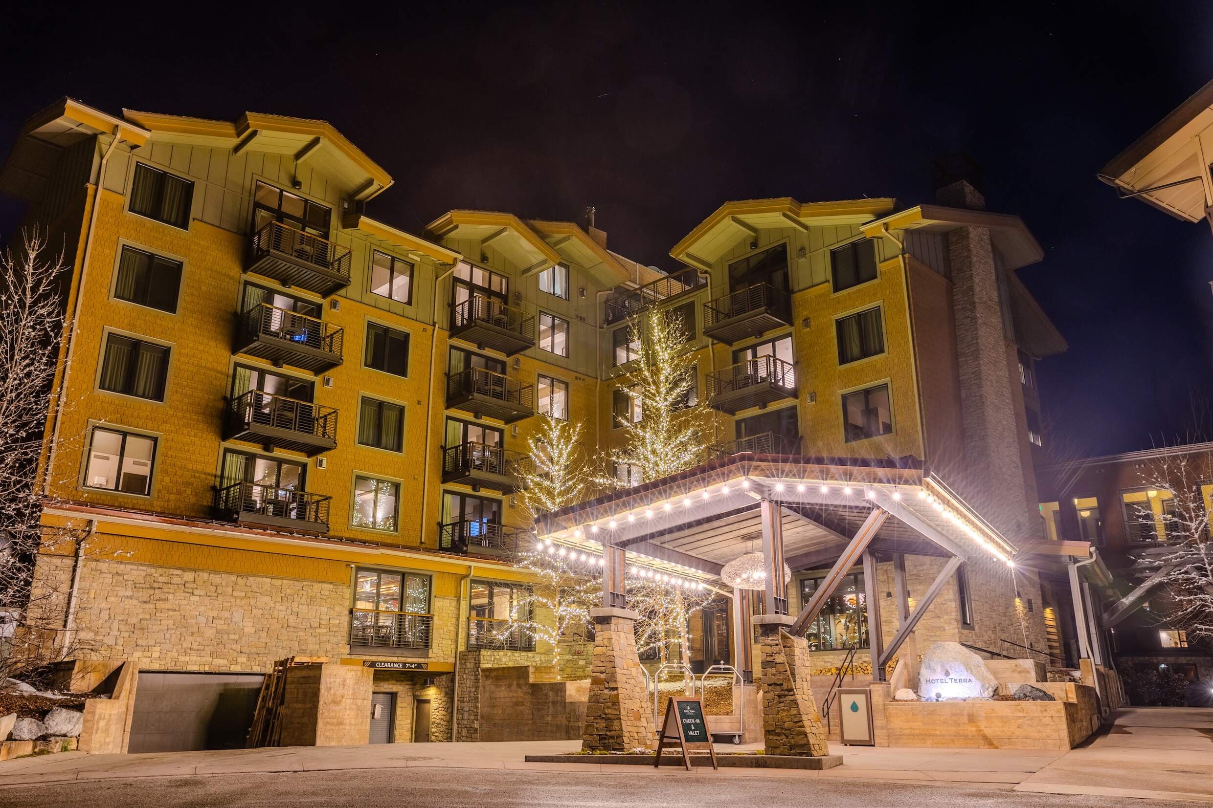 Entrance at night of Hotel Terra Jackson Hole in the heart of Teton Village in Wyoming.