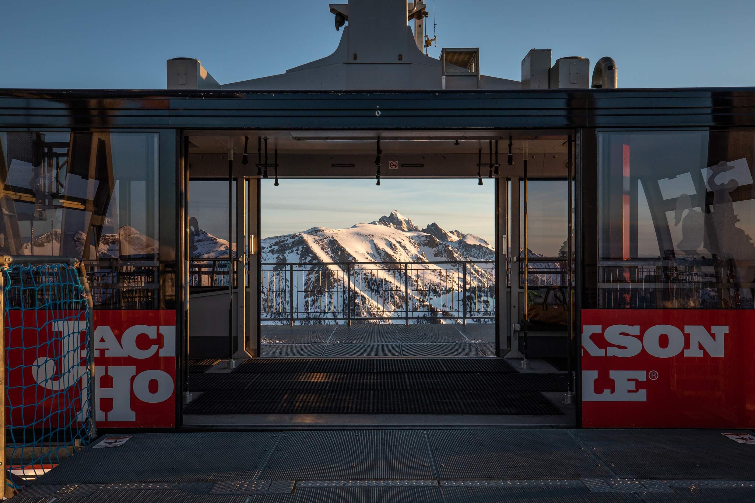 The tram at the station at Jackson Hole Mountain Resort with a view of the Teton Mountains in the background in Wyoming.
