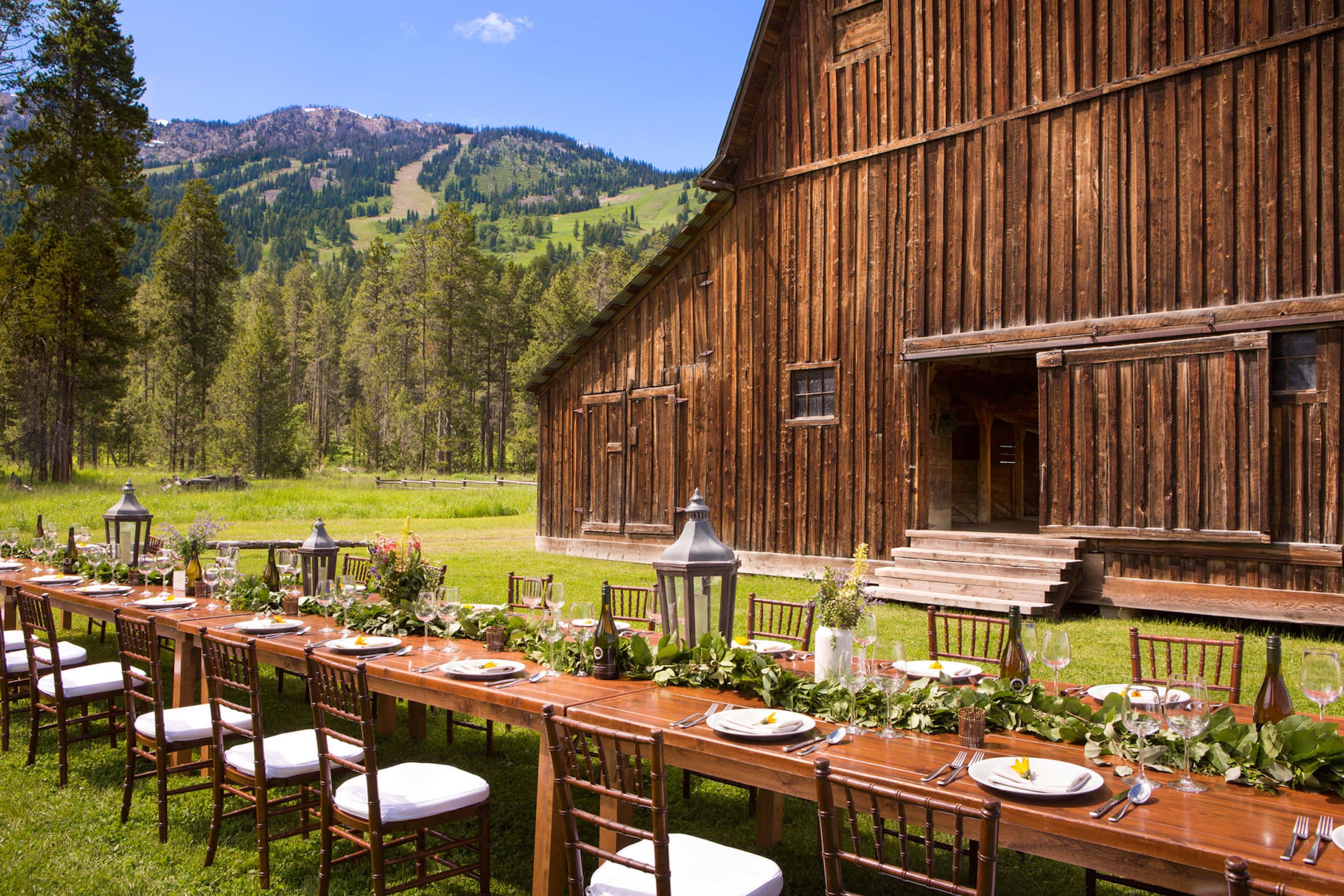 Rustic summer wedding venue at the Gray Barn in Jackson Hole Wyoming with menu by Spur Catering in daytime