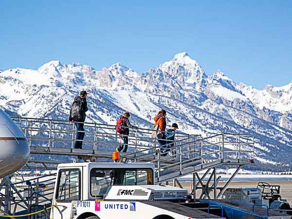 Family getting off an airplane in Jackson Hole.