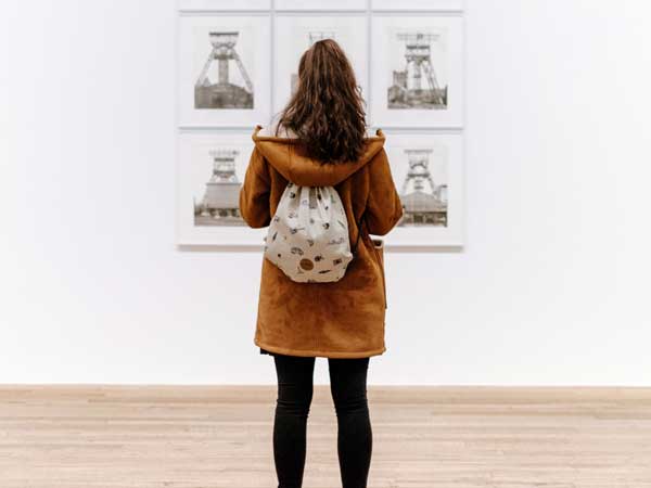 Woman viewing art, in Jackson Hole, WY