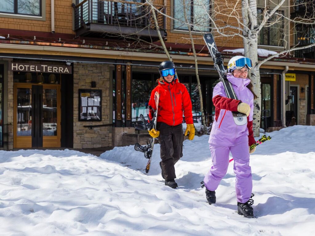 Skiers Coming Out Of Hotel Terra